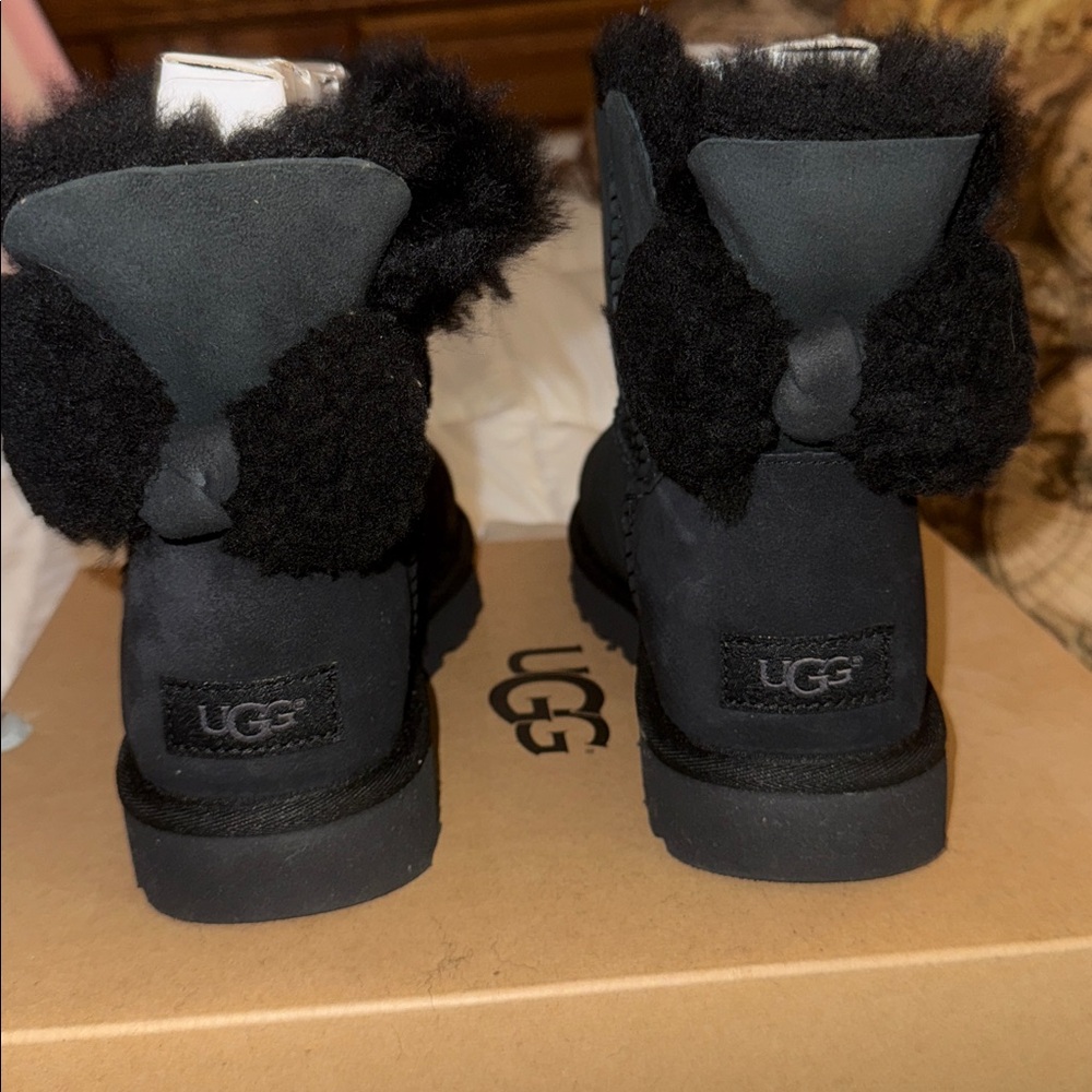 UGG Arielle Black Ankle Boots with fuzzy bow. Brand new in box. Authenticsize 8